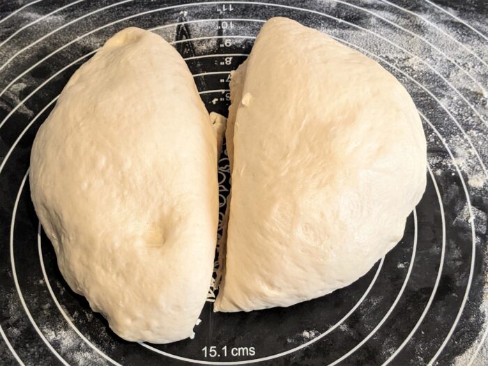 Cut the ball of dough into 2 equal pieces