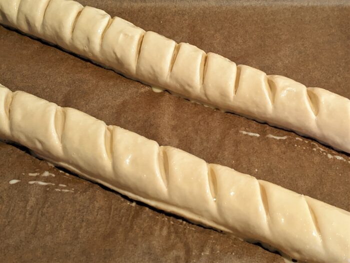 Brush the baguettes with the egg yolk