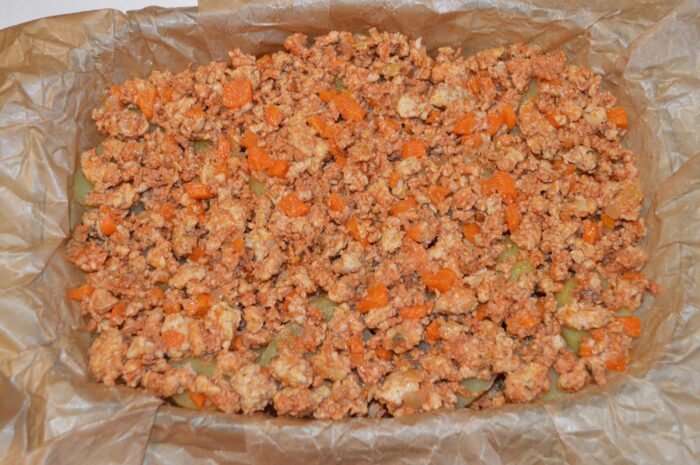 Second layer of meat filling spread evenly over the potato layer