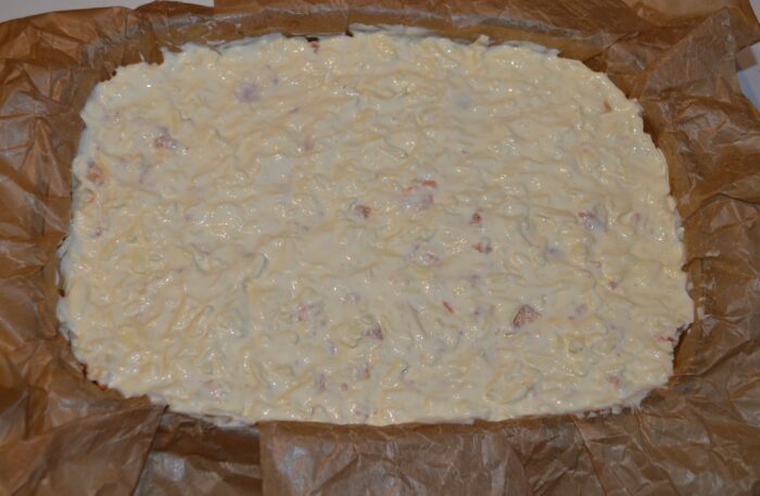 Moussaka baking in the oven with a golden, bubbling top layer