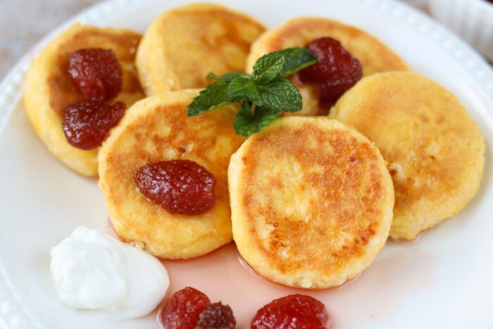 Frying cheese pancakes in a skillet until golden