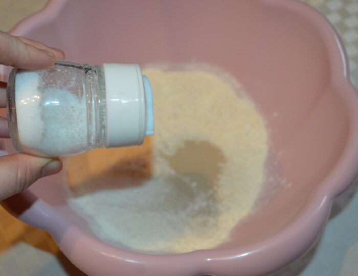 Dry pizza dough ingredients mixed together in the bowl