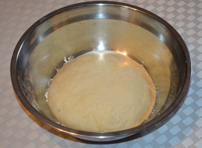 Risen pizza dough that has doubled in size